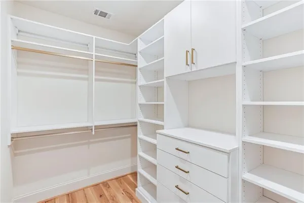 a view of an empty walk in closet