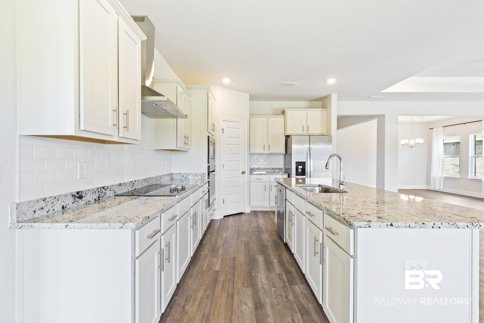 11303 Genuine Risk Circle Daphne, AL 36526 - Photo 26 of 100 Kitchen featuring tasteful backsplash, appliances with stainless steel finishes, sink, and decorative light fixtures