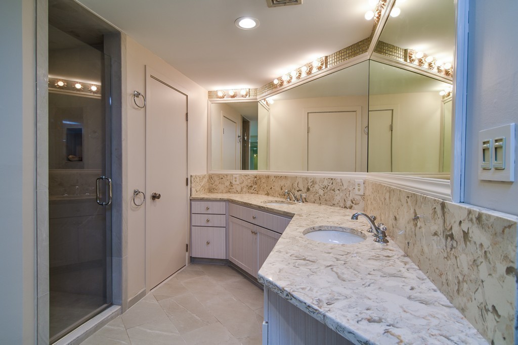 85 Algonquin Road, Unit 85 Chestnut Hill, MA 02467 - Photo 11 of 21 a spacious bathroom with a granite countertop sink mirror and shower