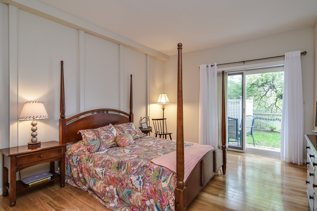 85 Algonquin Road, Unit 85 Chestnut Hill, MA 02467 - Photo 13 of 21 a bedroom with a bed and a large window