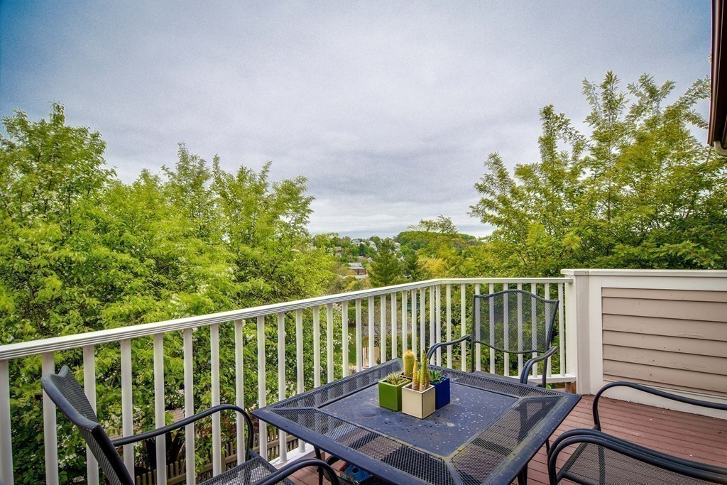 85 Algonquin Road, Unit 85 Chestnut Hill, MA 02467 - Photo 17 of 21 a view of a balcony with wooden floor
