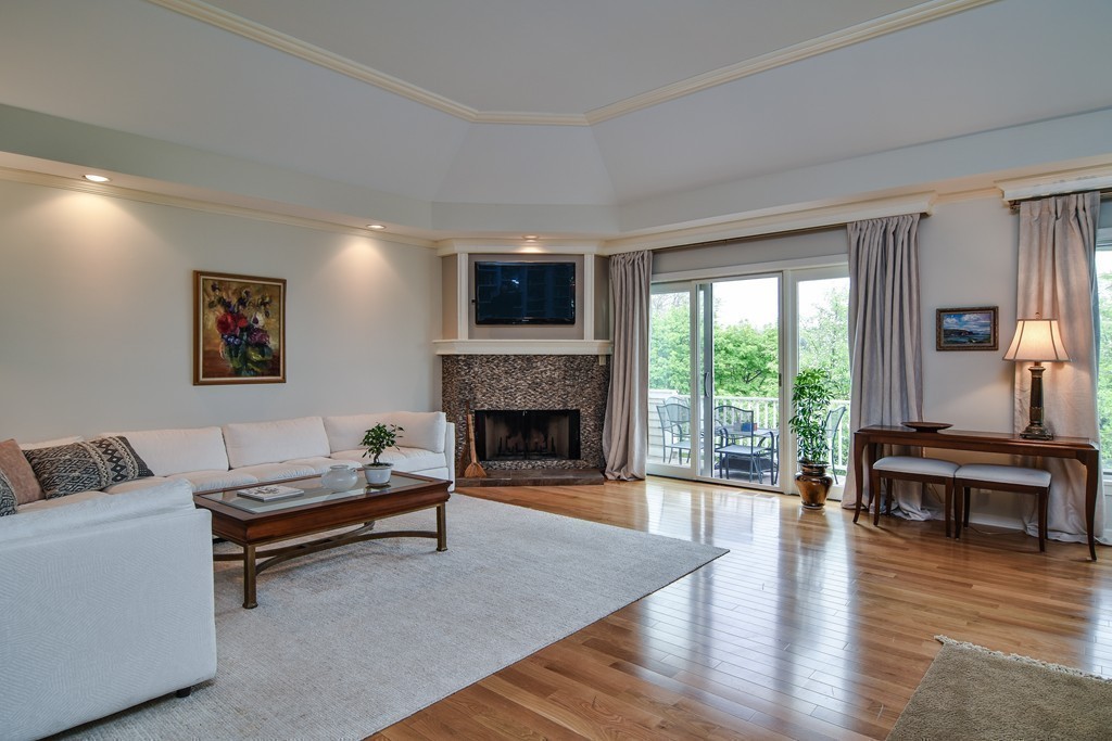 85 Algonquin Road, Unit 85 Chestnut Hill, MA 02467 - Photo 2 of 21 a living room with furniture fireplace and window
