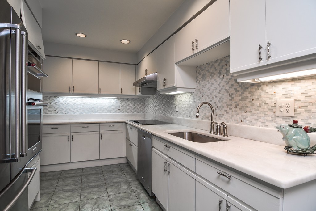 85 Algonquin Road, Unit 85 Chestnut Hill, MA 02467 - Photo 7 of 21 a kitchen with a sink cabinets and stainless steel appliances