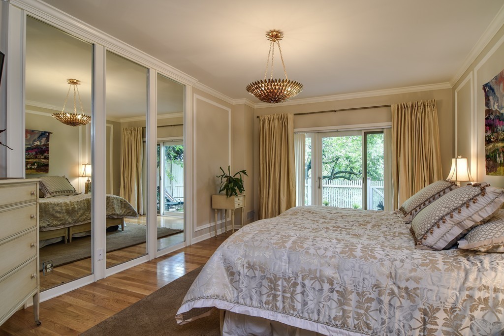 85 Algonquin Road, Unit 85 Chestnut Hill, MA 02467 - Photo 10 of 21 a bedroom with a bed and a large window