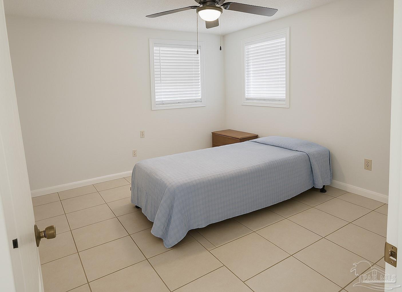 6274 Munson Highway Milton, FL 32570 - Photo 21 of 26 a bedroom with a bed and a window