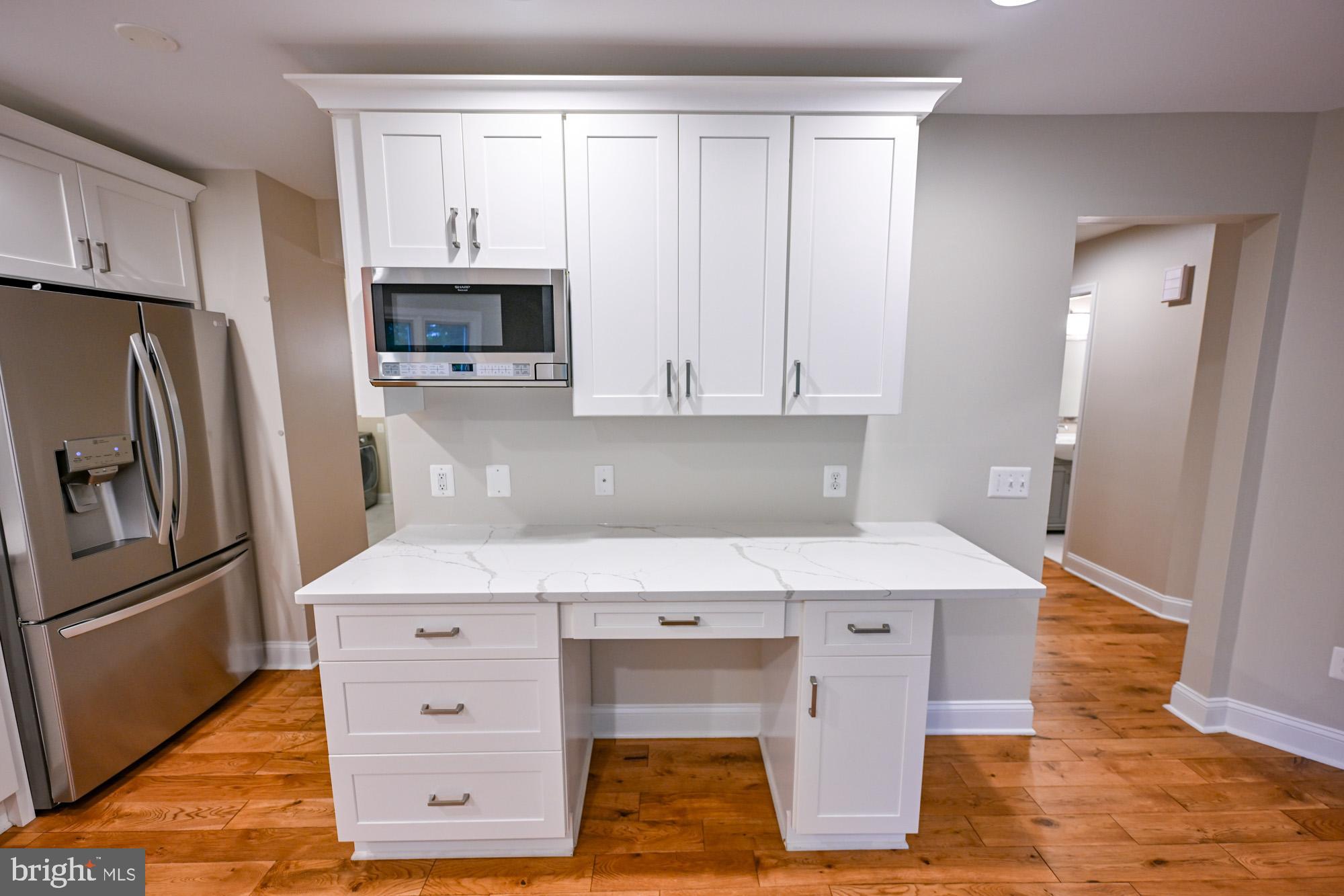 622 Hastings Road Baltimore, MD 21286 - Photo 23 of 87 a kitchen with stainless steel appliances a stove microwave and refrigerator