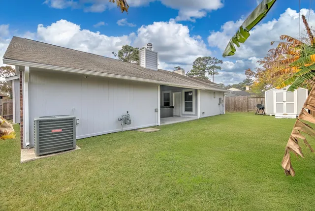 a view of a house with a backyard