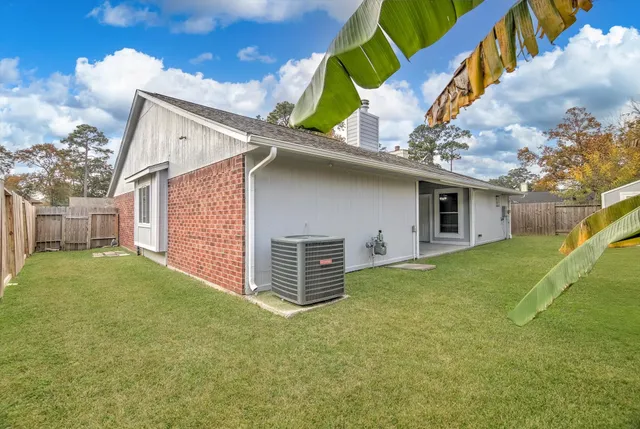 a backyard of a house with a garden and deck