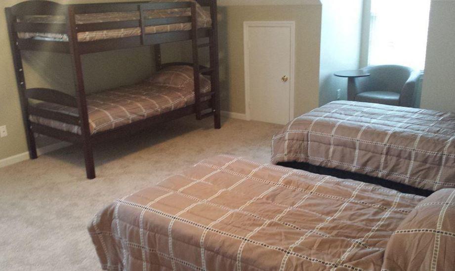 1952 Portway Road Spring Hill, TN 37174 - Photo 5 of 12 a bedroom with a bed and a window