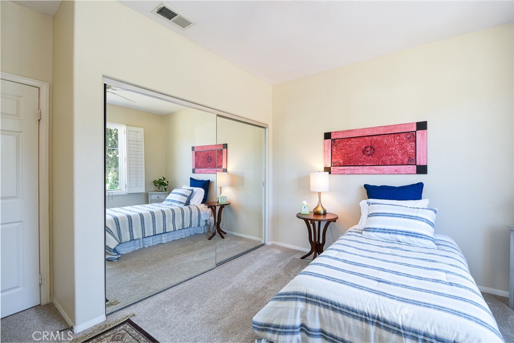 41686 Monterey Place Temecula, CA 92591 - Photo 25 of 51 a bedroom with bed and wooden floor