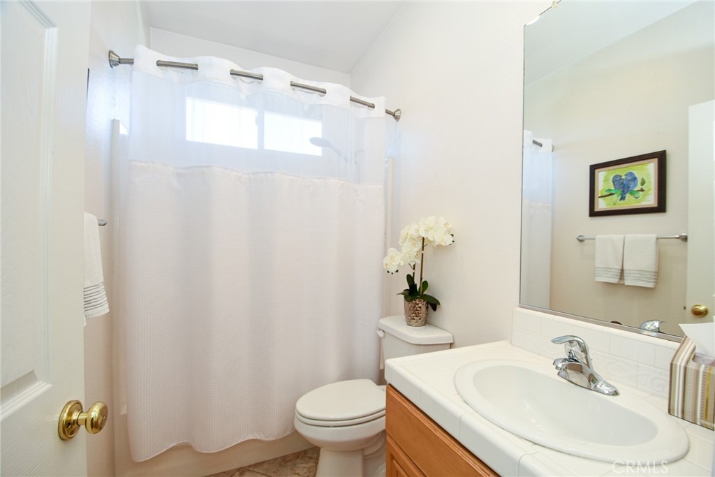 41686 Monterey Place Temecula, CA 92591 - Photo 26 of 51 a bathroom with a sink toilet and shower