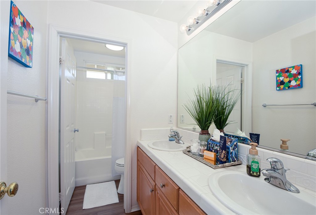 41686 Monterey Place Temecula, CA 92591 - Photo 32 of 51 a bathroom with a sink a vanity and a mirror
