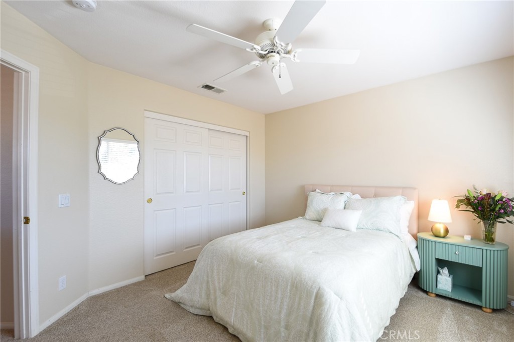 41686 Monterey Place Temecula, CA 92591 - Photo 34 of 51 a bedroom with a bed and a chandelier