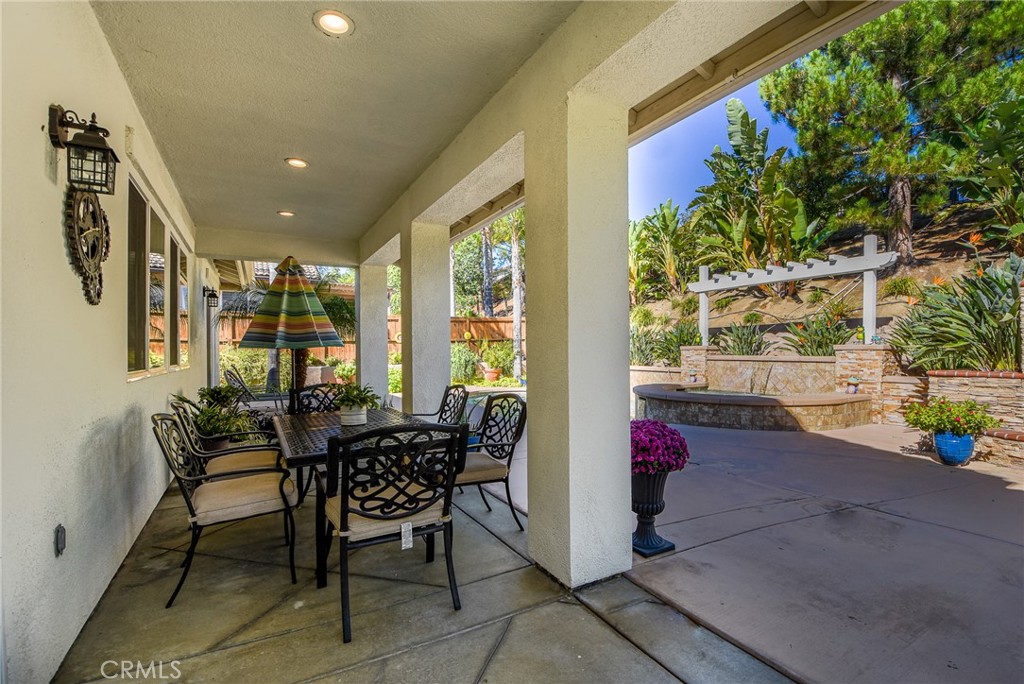 41686 Monterey Place Temecula, CA 92591 - Photo 41 of 51 a patio with yard glass top table and chairs