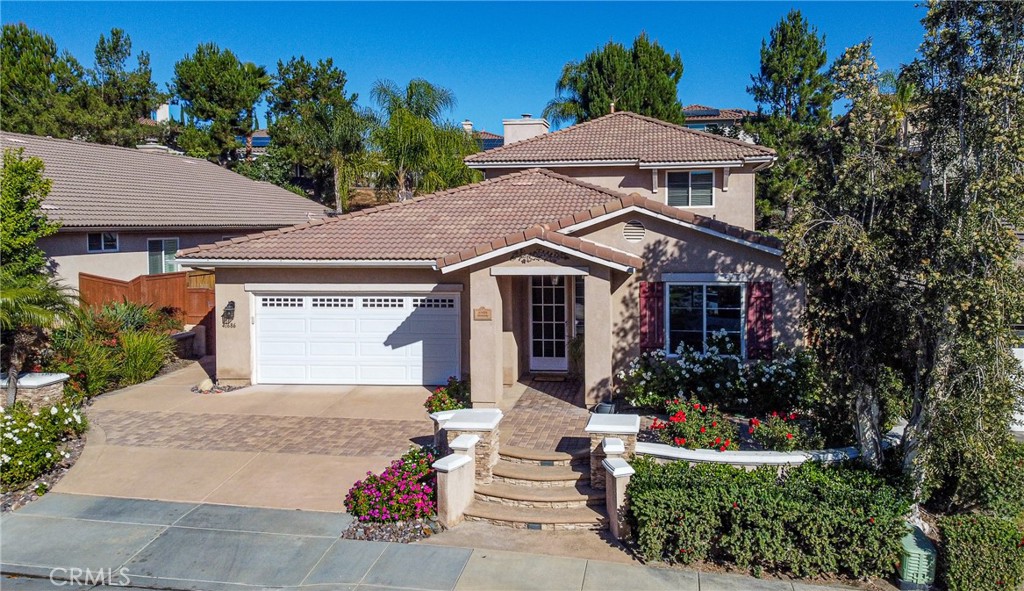 41686 Monterey Place Temecula, CA 92591 - Photo 43 of 51 a front view of a house with a garden