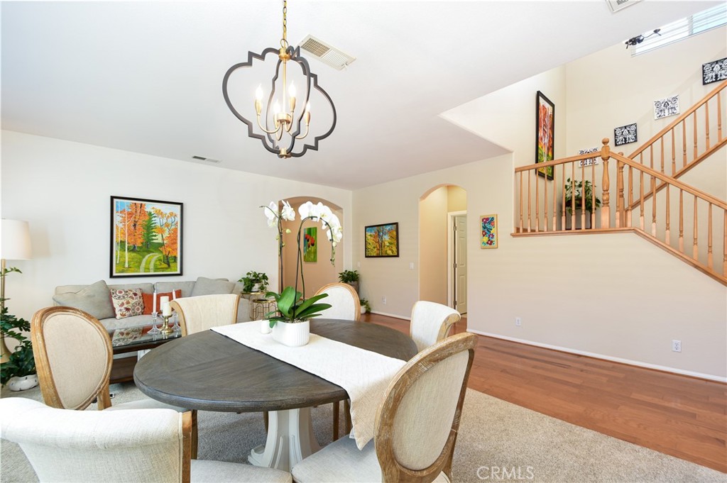 41686 Monterey Place Temecula, CA 92591 - Photo 6 of 51 a view of a dining room with furniture and wooden floor