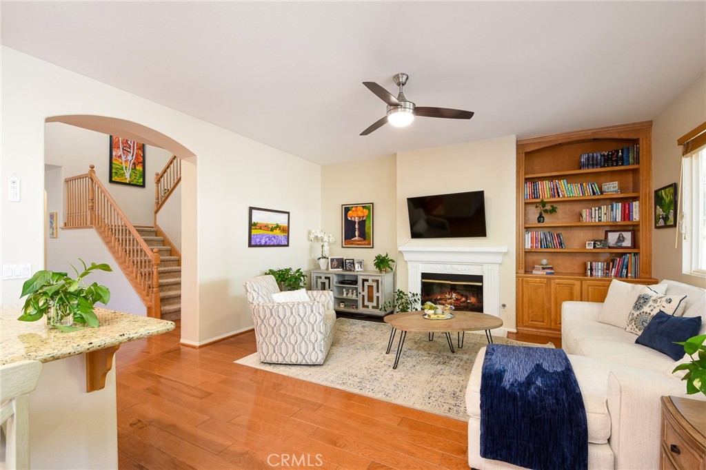 41686 Monterey Place Temecula, CA 92591 - Photo 10 of 51 a living room with furniture a fireplace and a flat screen tv