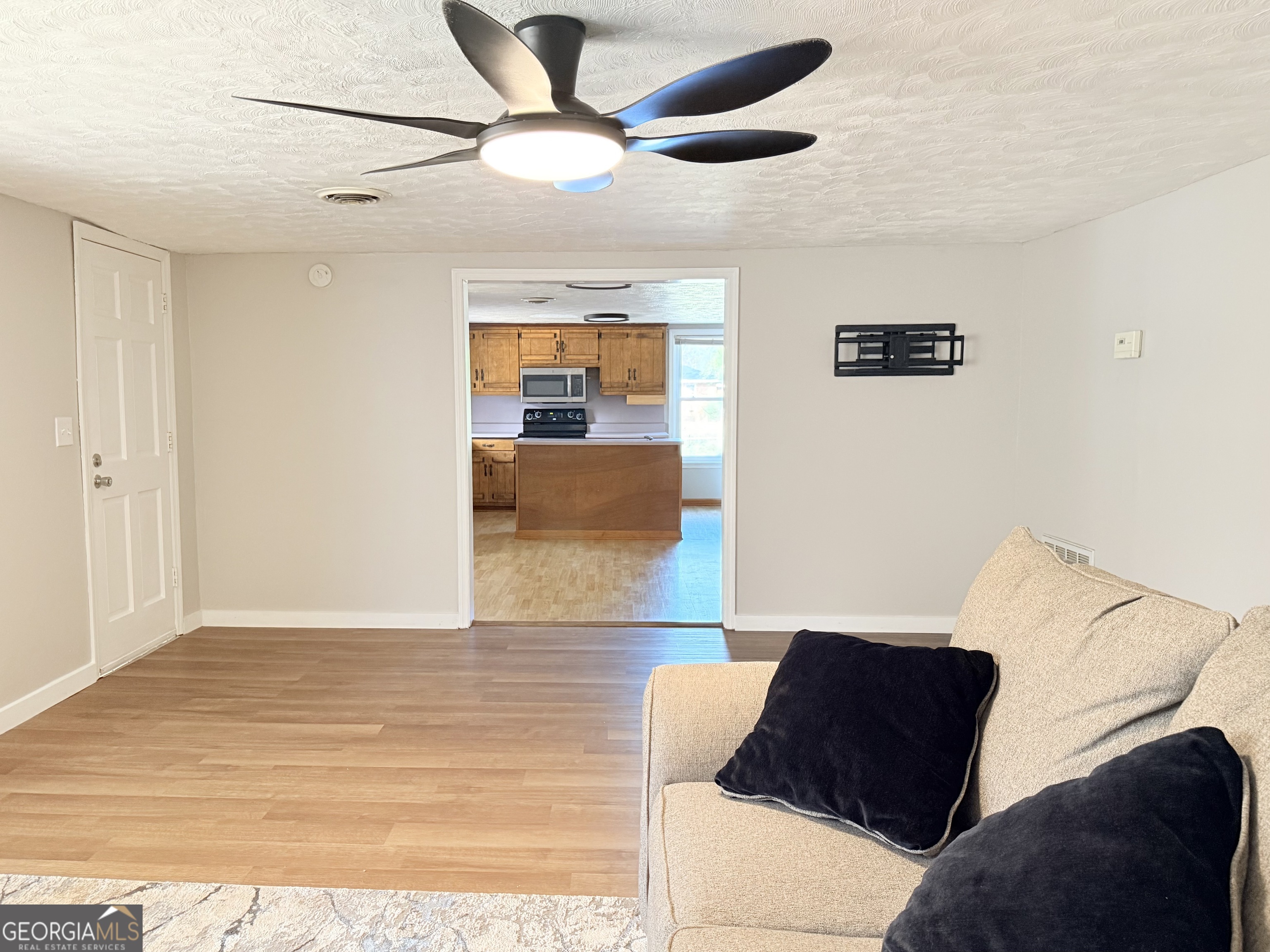 123 Church Road Thomaston, GA 30286 - Photo 27 of 28 a living room with furniture and a rug