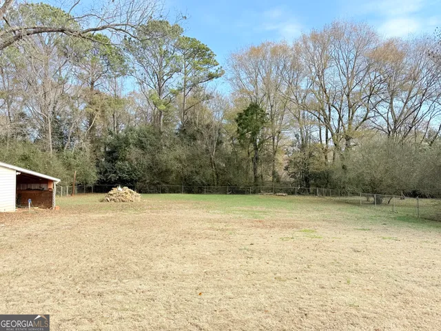 a view of a lake with a yard