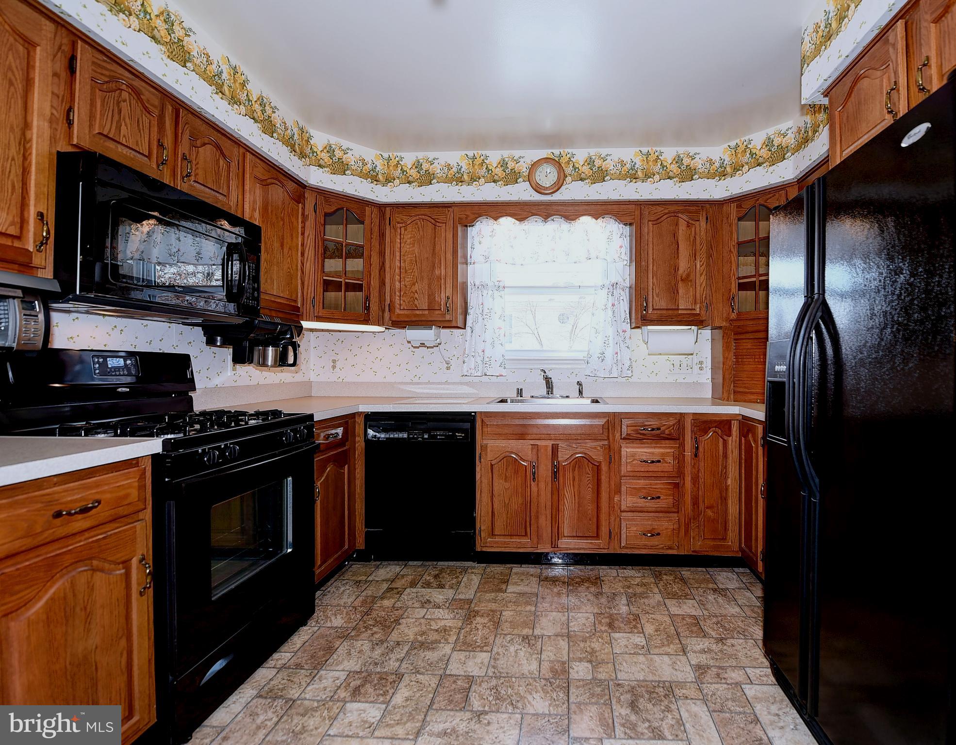 2505 Perring Woods Road Baltimore, MD 21234 - Photo 11 of 44 Generously sized kitchen with gas stove