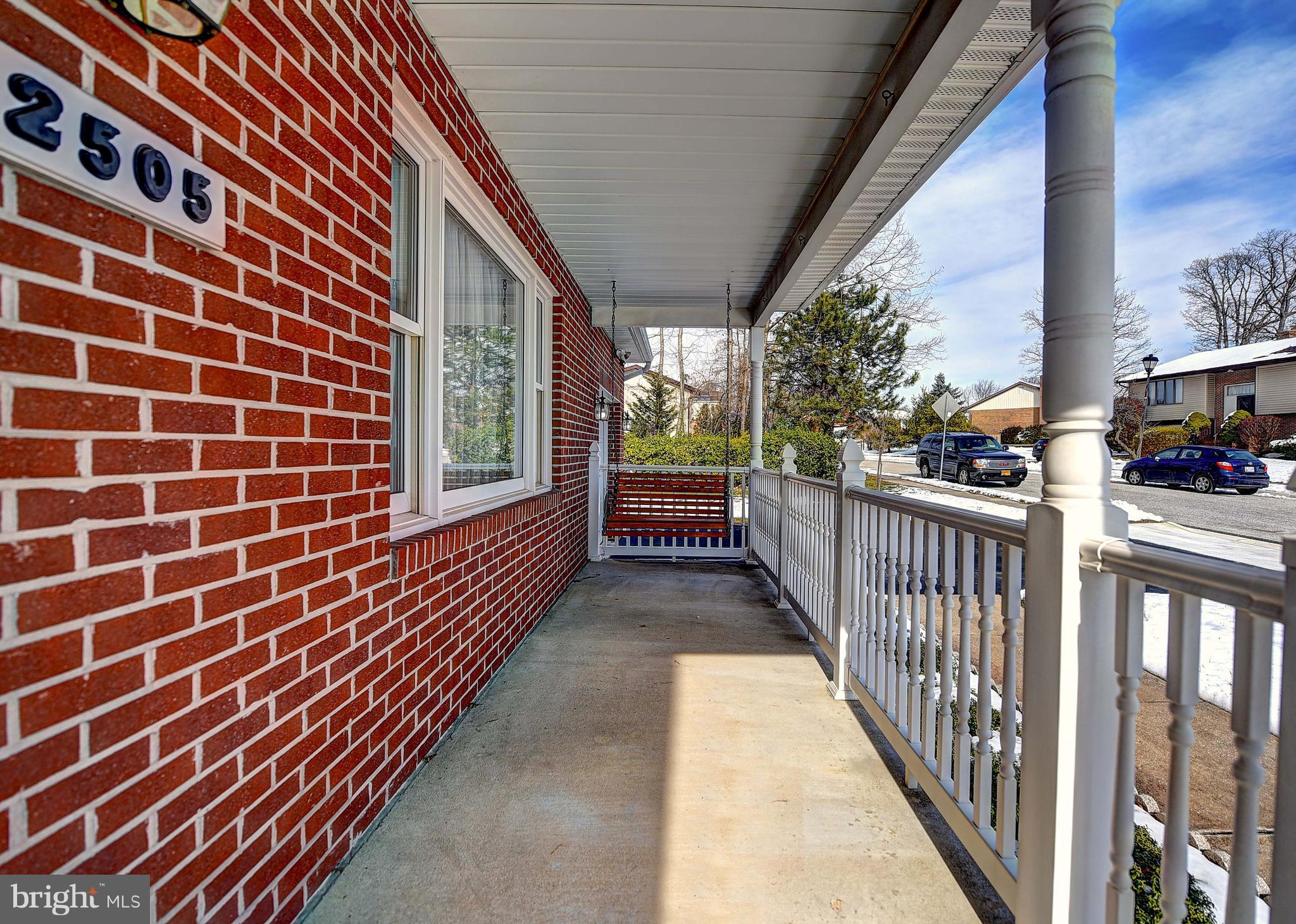 2505 Perring Woods Road Baltimore, MD 21234 - Photo 5 of 44 Covered brick front with vinyl posts