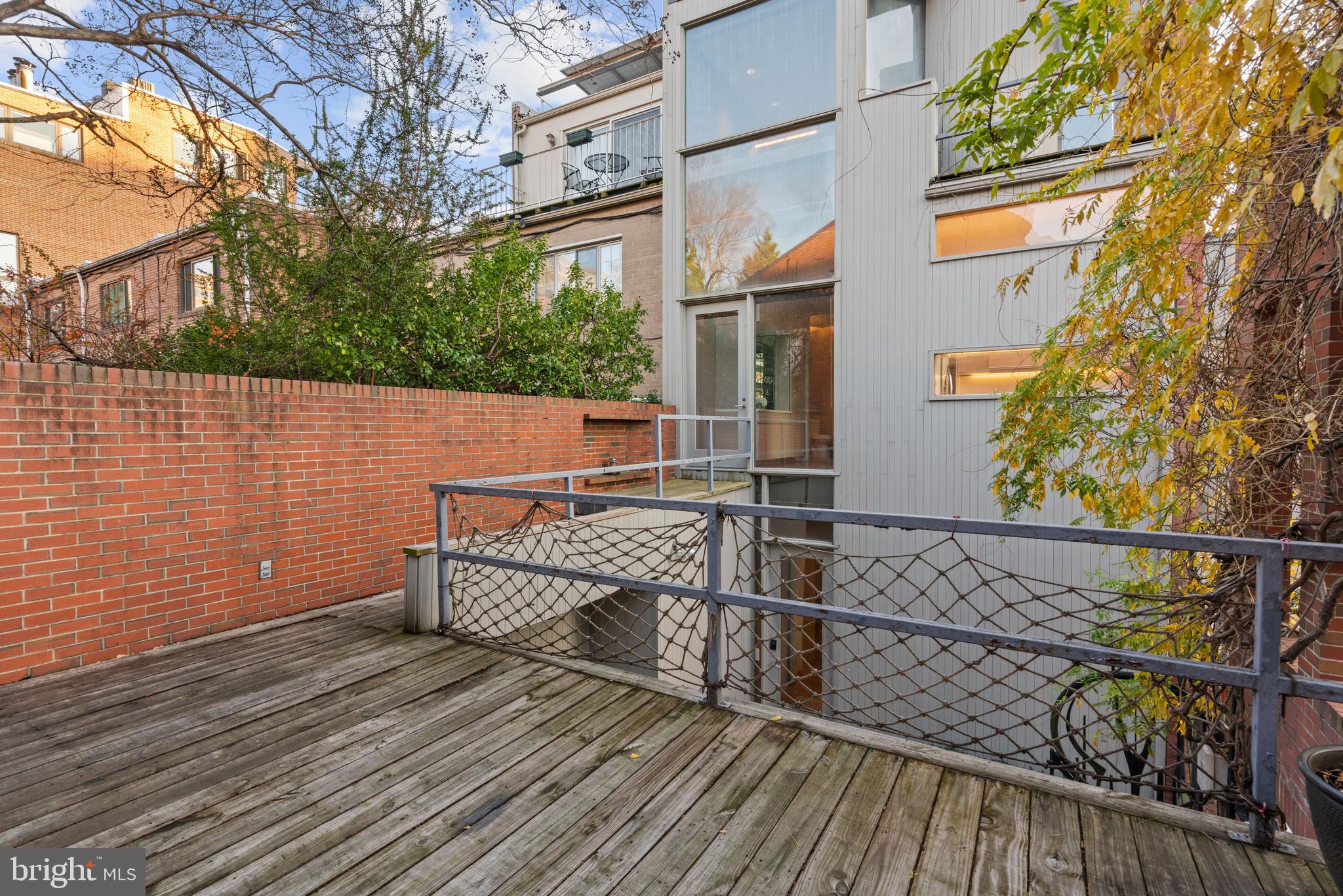 901 26th Street Northwest Washington, DC 20037 - Photo 22 of 32 a view of balcony with wooden floor and seating space