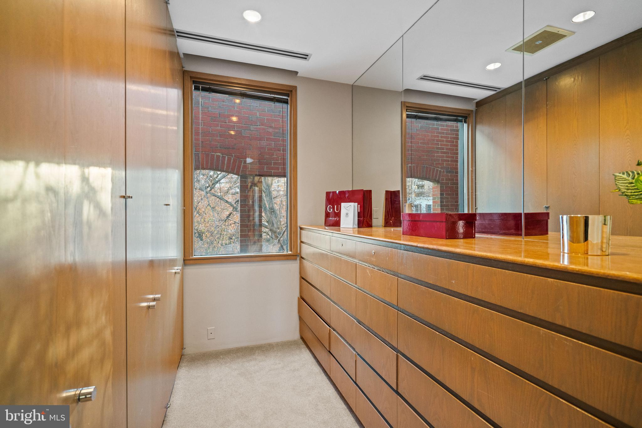 901 26th Street Northwest Washington, DC 20037 - Photo 28 of 32 a bathroom with a double vanity sink and mirror