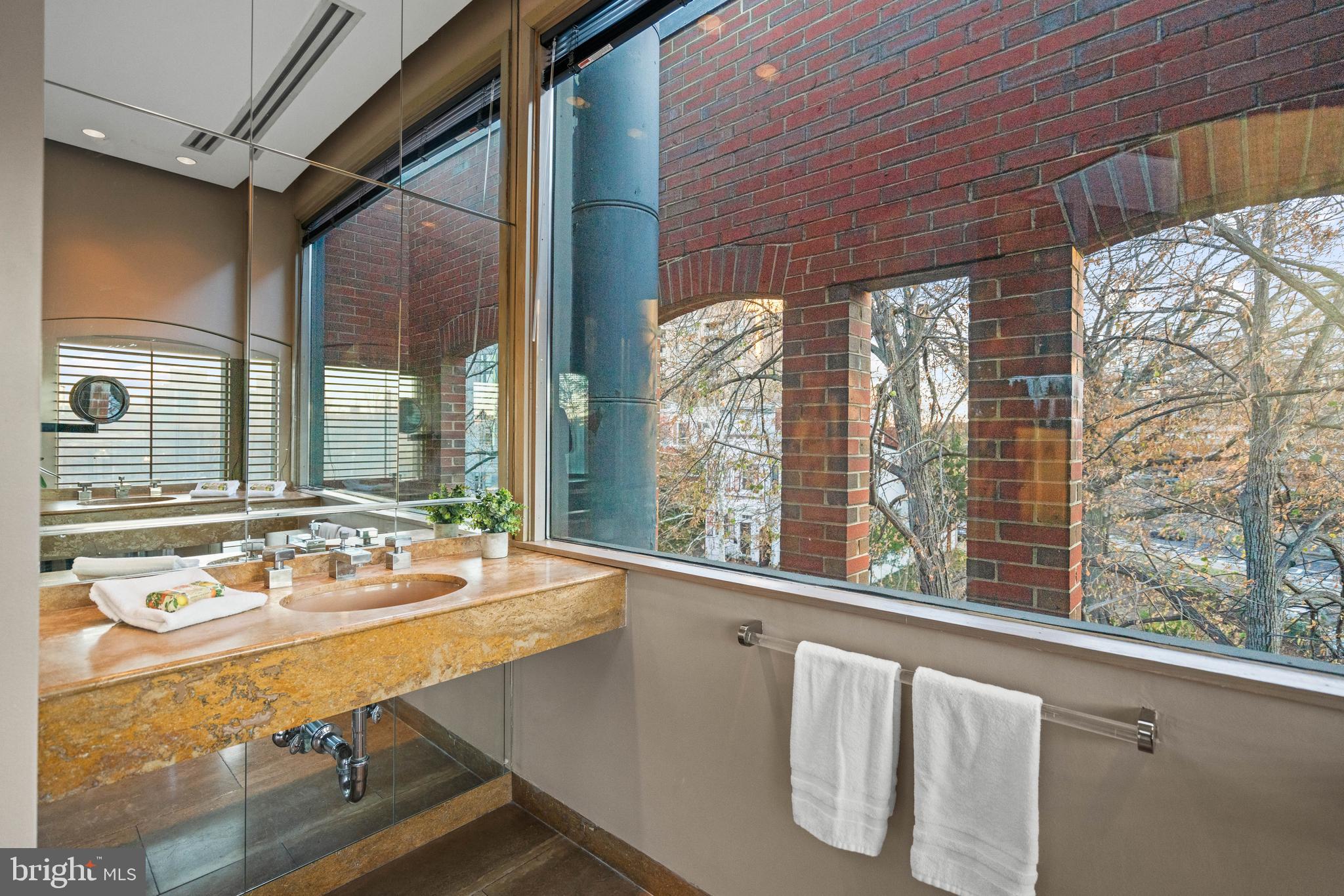 901 26th Street Northwest Washington, DC 20037 - Photo 31 of 32 a bathroom with a sink and a large window