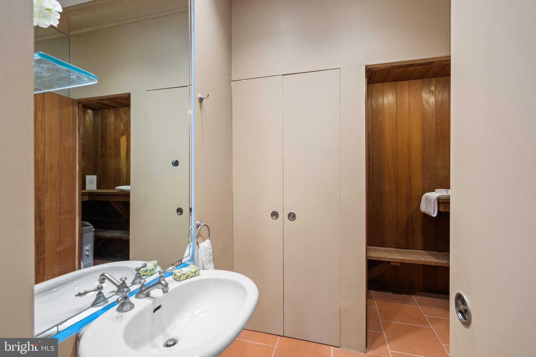 901 26th Street Northwest Washington, DC 20037 - Photo 8 of 32 a bathroom with a sink and a mirror