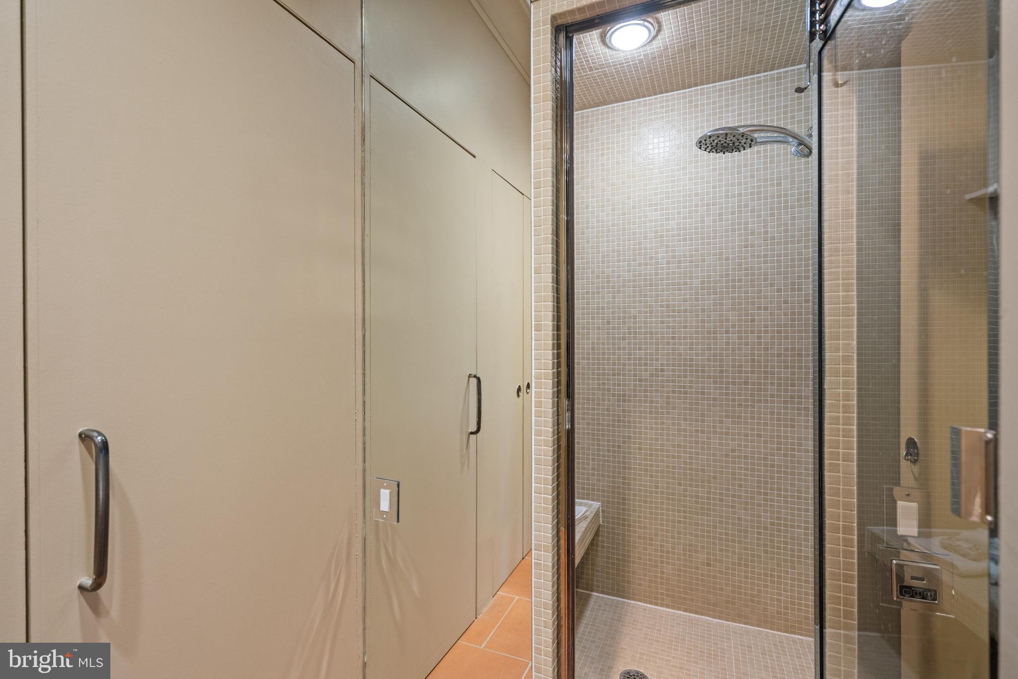 901 26th Street Northwest Washington, DC 20037 - Photo 9 of 32 a bathroom with a glass shower door