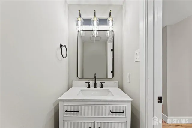 a view of a room with wooden floors