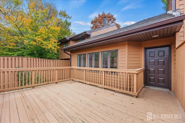 a view of backyard with deck and deck
