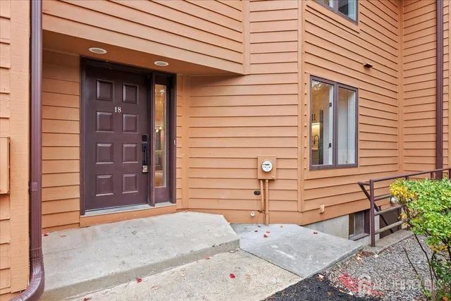 a front view of a house with a garage