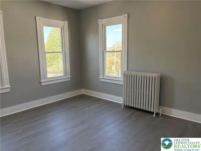 a bathroom with a double vanity sink mirror and shower