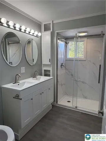 an empty room with windows and entrance