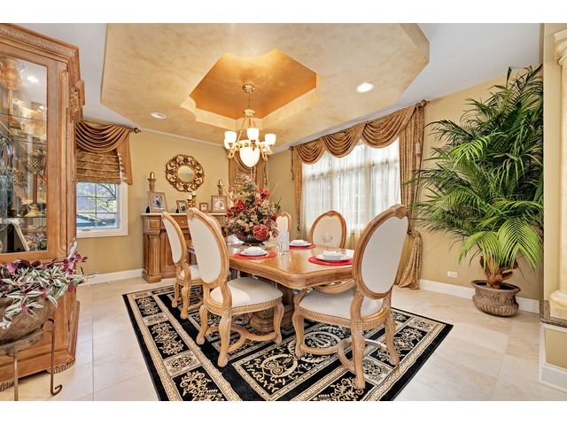 1415 Tyrell Avenue Park Ridge, IL 60068 - Photo 13 of 25 a view of a dining room with furniture a chandelier and wooden floor