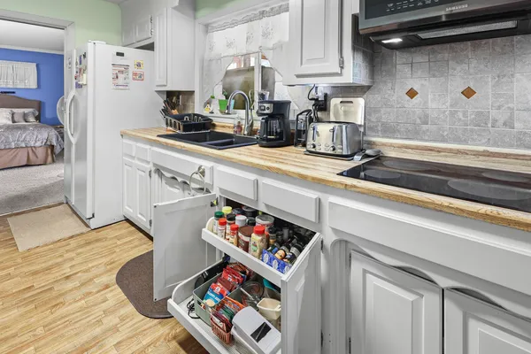 a bathroom with a toilet sink and shower