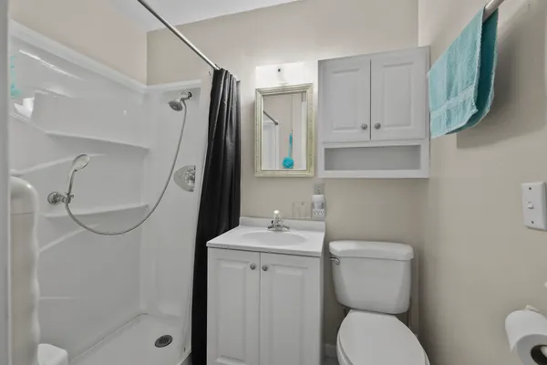 a bedroom with a bed and a table