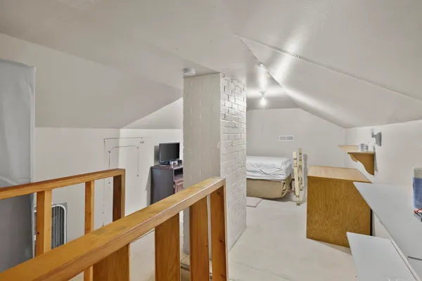 a room with patio furniture and a large window