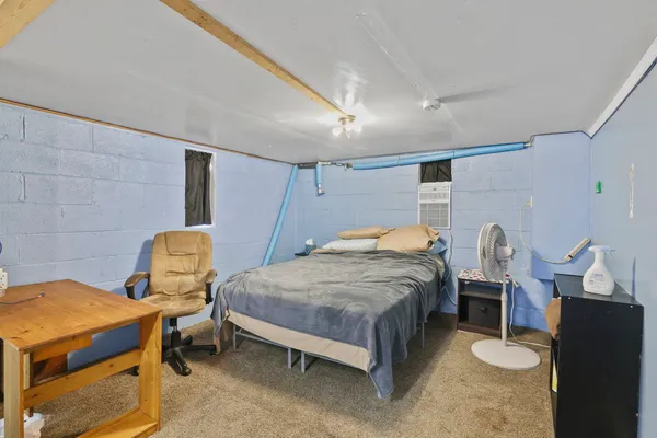 a view of a patio with a table and chairs and wooden floor