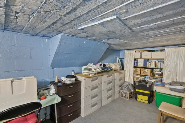 a view of a house with backyard and a garage