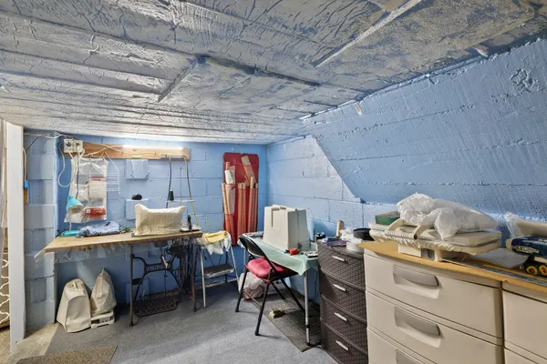 a view of a building with snow on the side of the road