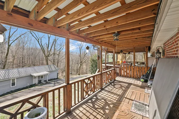 a bedroom with a bed dresser and a window