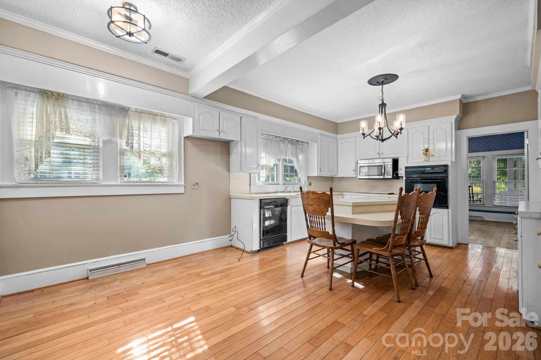 144 Hunter Bridge Road Stony Point, NC 28678 - Photo 6 of 45 a dining room with furniture and wooden floor