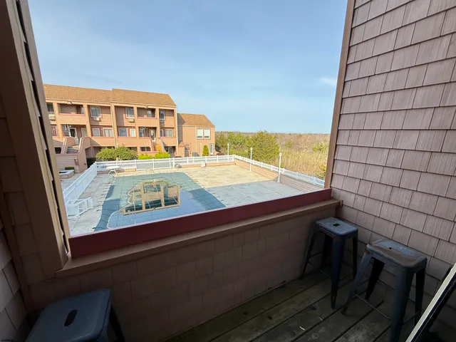 a view of swimming pool from a balcony