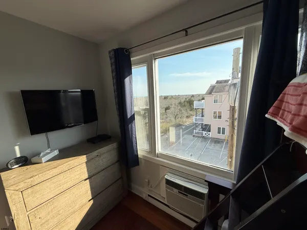 a room with furniture and a flat screen tv