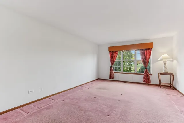 a view of a room with a large window