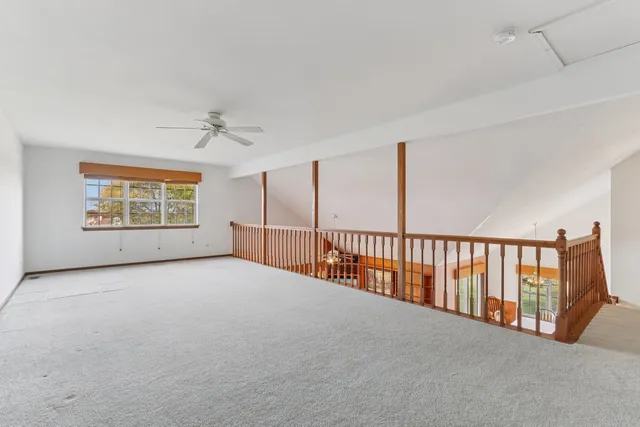 a view of an empty room with windows