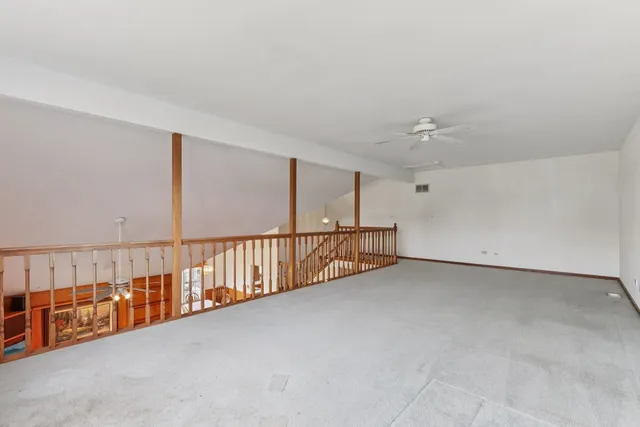 a view of an empty room with windows