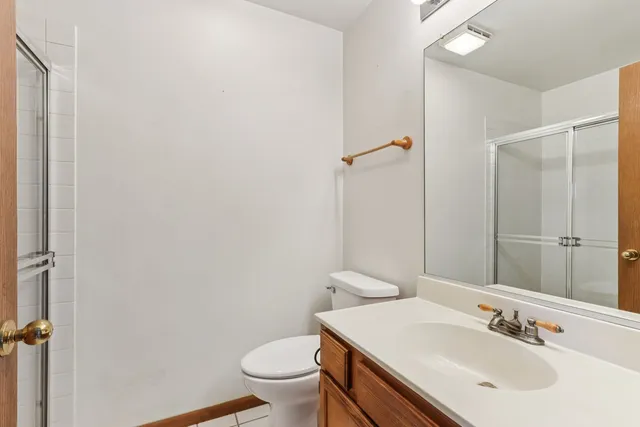 a bathroom with a sink toilet and vanity